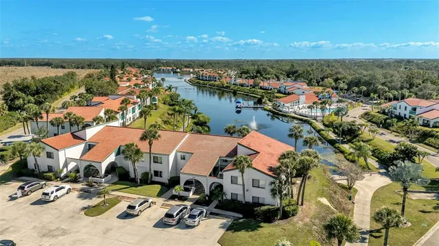an aerial view of a houses with a swimming pool