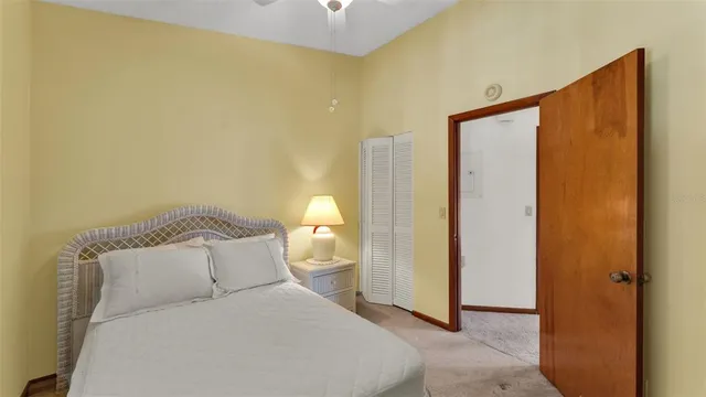 a bedroom with a bed and a mirror