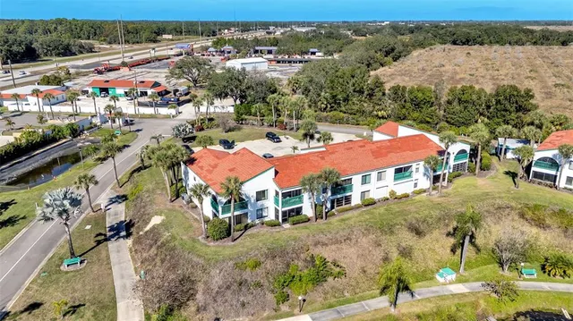 an aerial view of residential houses and outdoor space