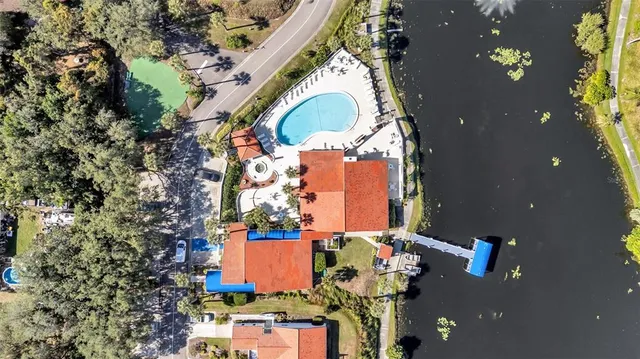 an aerial view of a house with a yard