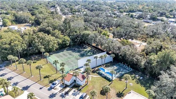 an outdoor space with swimming pool and lake view