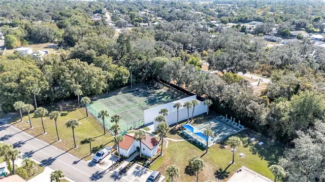 an outdoor space with swimming pool and lake view