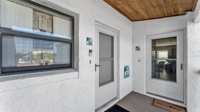 a view of a hallway with wooden floor and a fireplace