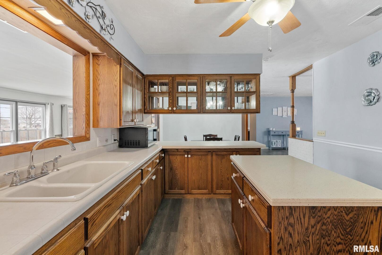 301 North Washington Street Atkinson, IL 61235 - Photo 19 of 45 a kitchen with a sink a counter top space and appliances