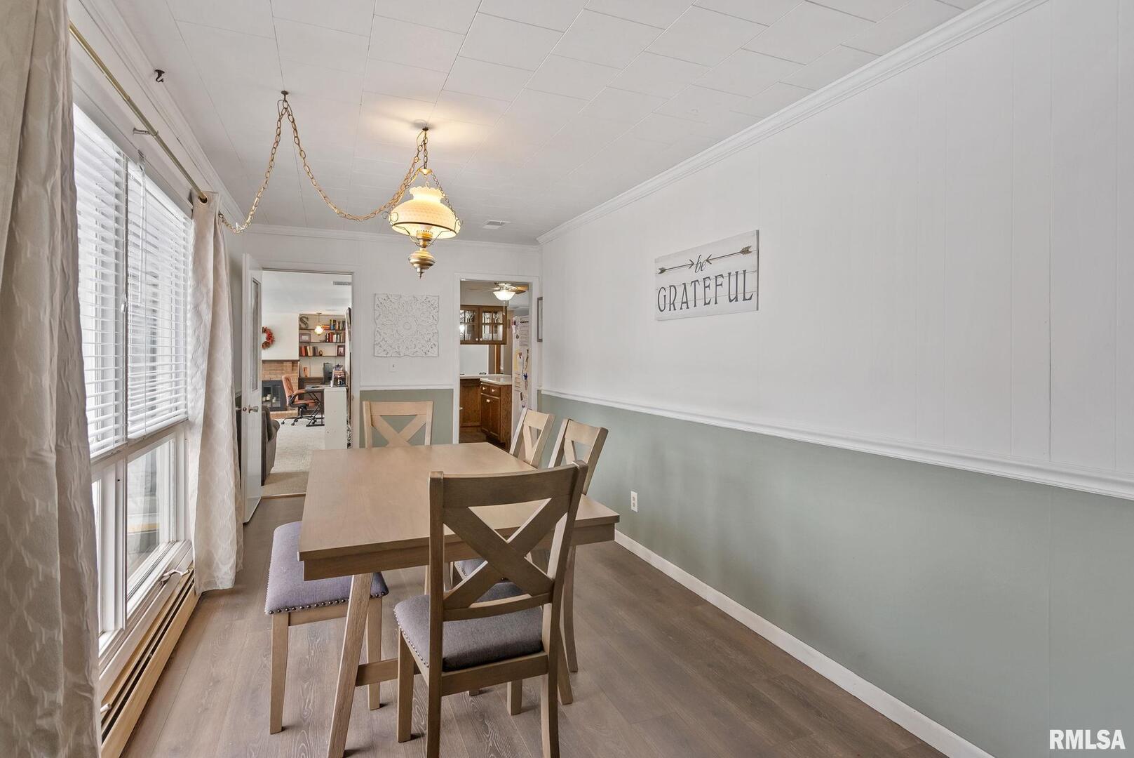 301 North Washington Street Atkinson, IL 61235 - Photo 21 of 45 a dining room with furniture a chandelier and wooden floor