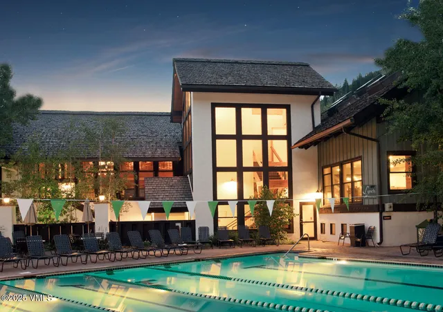 swimming pool view with a outdoor seating space