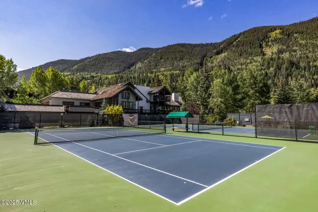a view of an outdoor space and tennis court