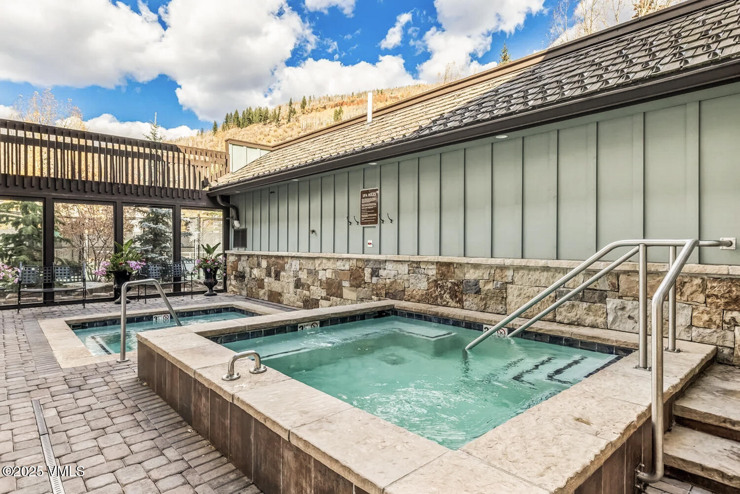 4650 Vail Racquet Club Drive, Unit 21 Vail, CO 81657 - Photo 21 of 29 a view of a house with pool and chairs
