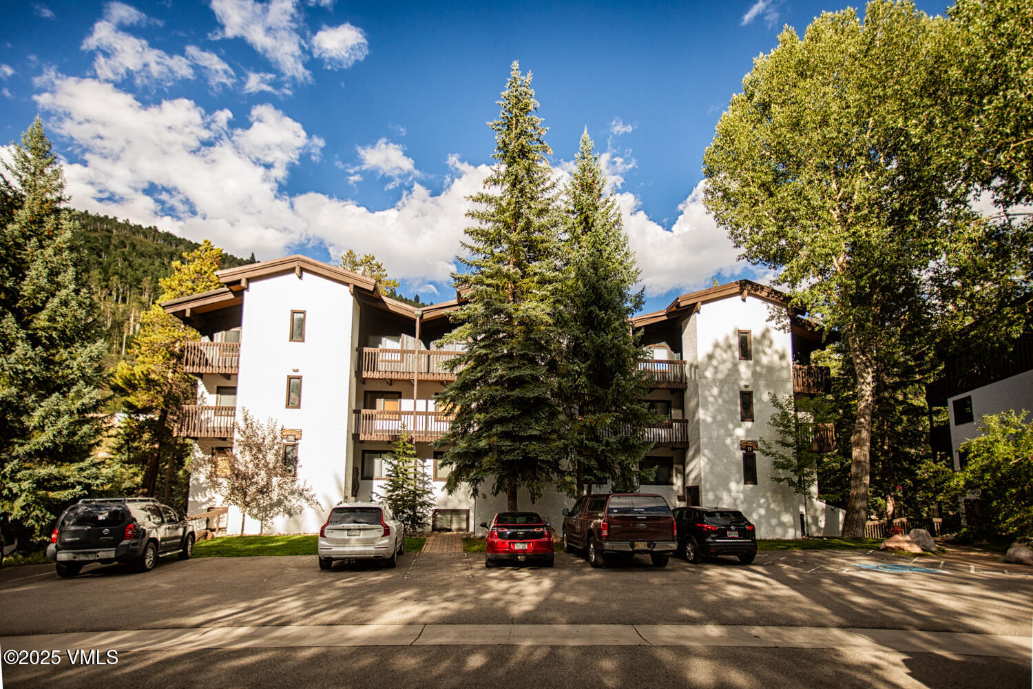 4650 Vail Racquet Club Drive, Unit 21 Vail, CO 81657 - Photo 27 of 29 a car parked in front of a building