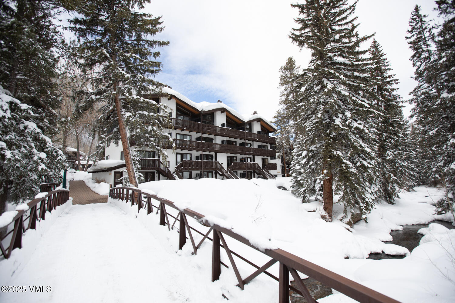 4650 Vail Racquet Club Drive, Unit 21 Vail, CO 81657 - Photo 3 of 29 a view of a terrace with a snow