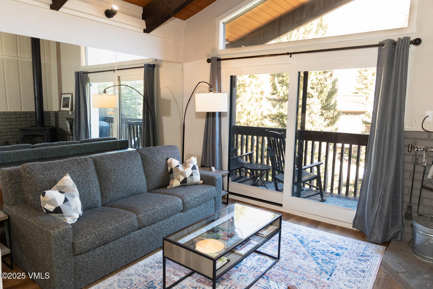 4650 Vail Racquet Club Drive, Unit 21 Vail, CO 81657 - Photo 7 of 29 a living room with furniture and a large window
