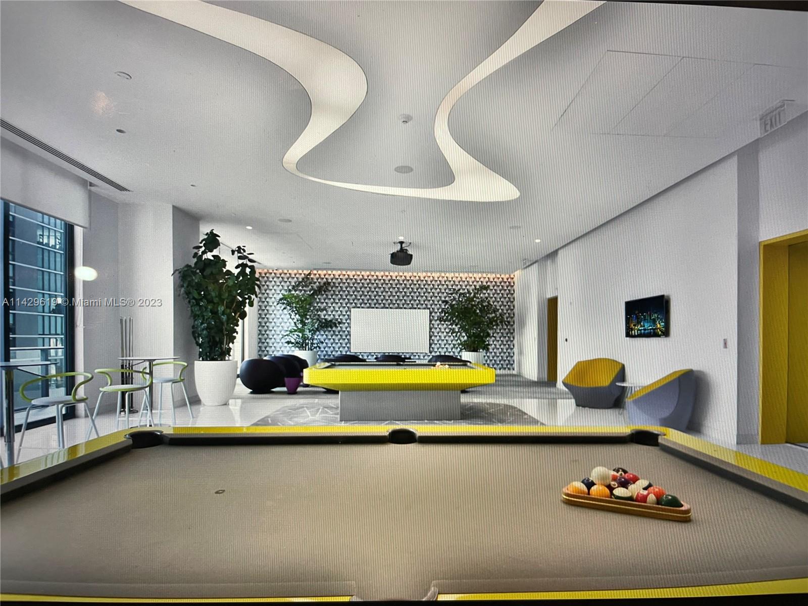 a swimming pool with an outdoor seating space