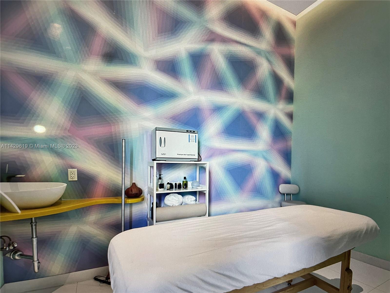 Paraiso Bayviews Miami, FL 33137 - Photo 3 of 5 a bedroom with a bed and painting on the wall