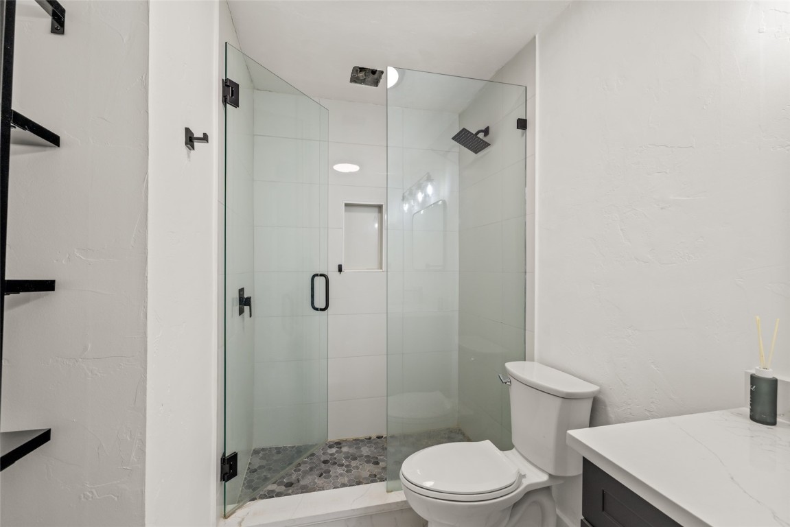 1375 Walton Creek Road, Unit 7 Steamboat Springs, CO 80487 - Photo 14 of 21 a white toilet sitting next to a bathroom sink