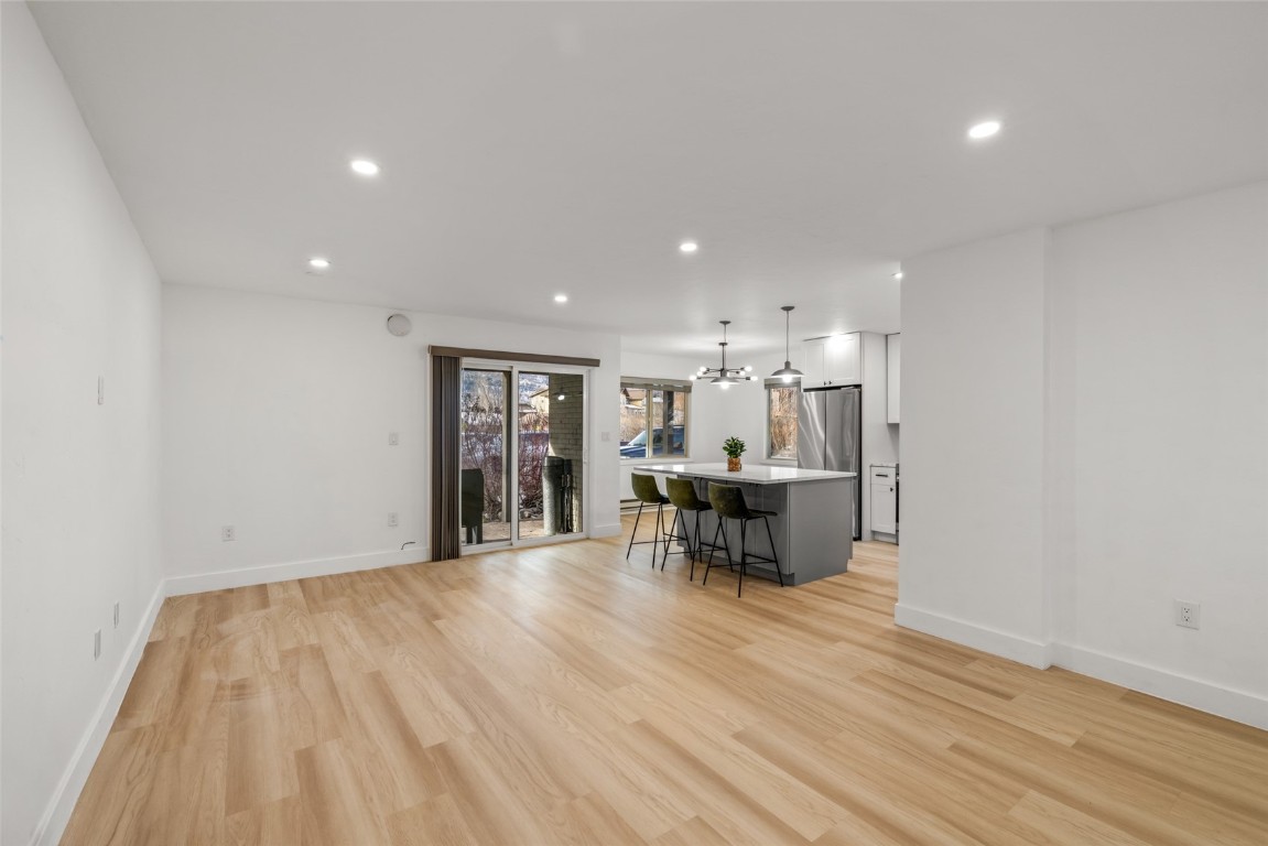 1375 Walton Creek Road, Unit 7 Steamboat Springs, CO 80487 - Photo 4 of 21 a view of dining room with furniture and wooden floor