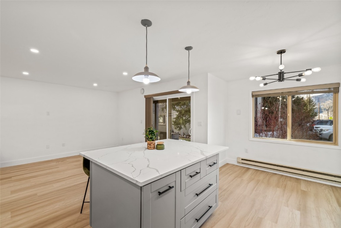 1375 Walton Creek Road, Unit 7 Steamboat Springs, CO 80487 - Photo 8 of 21 a view of an empty room with a window and wooden floor