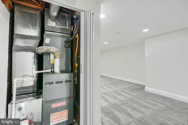 a view of a refrigerator in kitchen and wooden floor