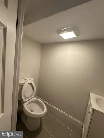 a bathroom with a toilet and a sink