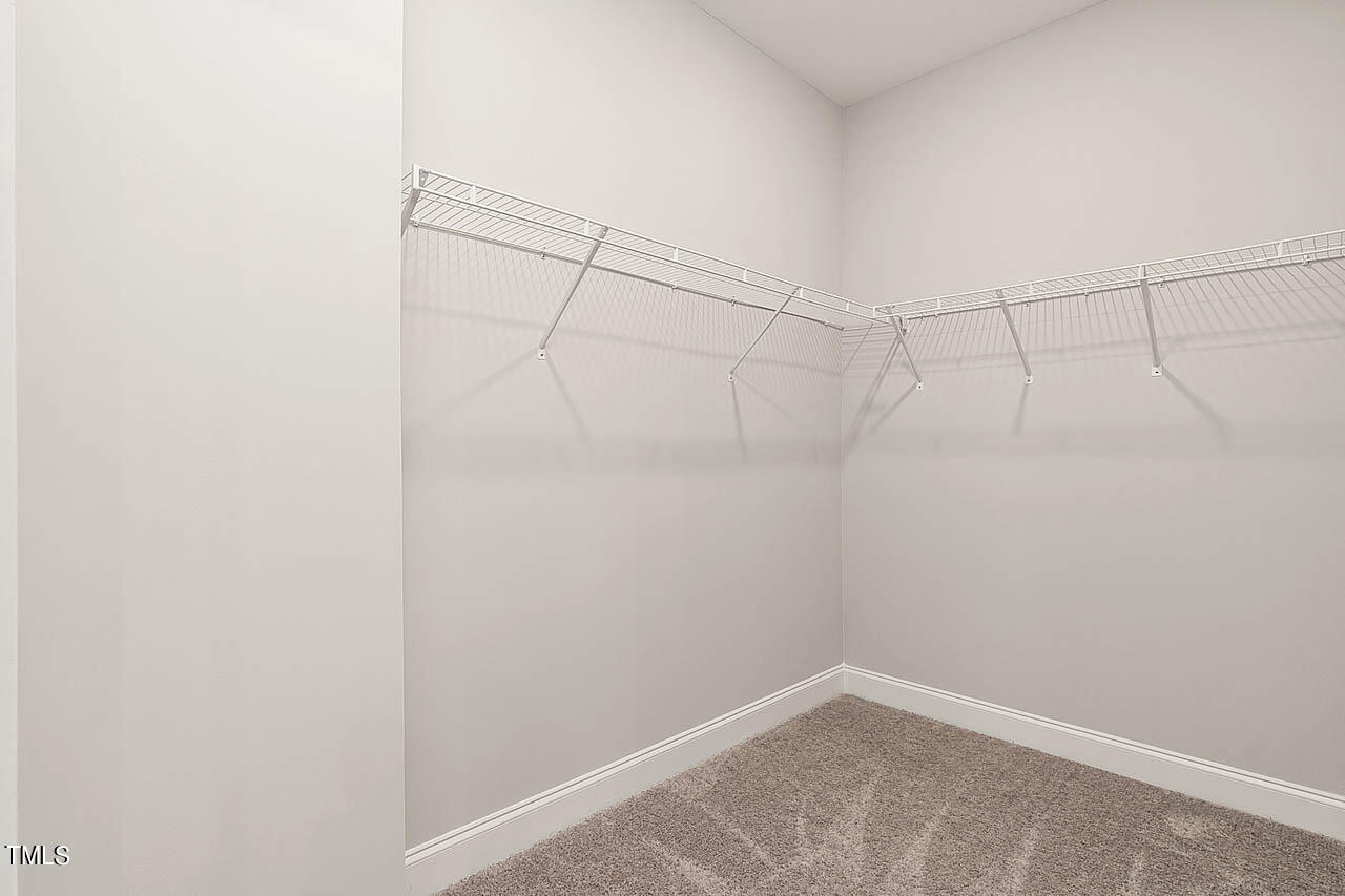 138 Rawhide Drive Spring Hope, NC 27882 - Photo 11 of 32 a view of a room with racks on the wall