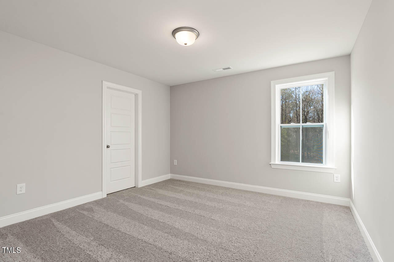 138 Rawhide Drive Spring Hope, NC 27882 - Photo 14 of 32 a view of an empty room with a window