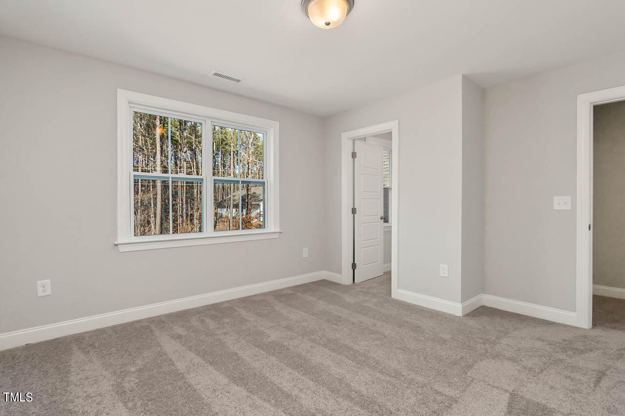 138 Rawhide Drive Spring Hope, NC 27882 - Photo 17 of 32 a view of an empty room with a window