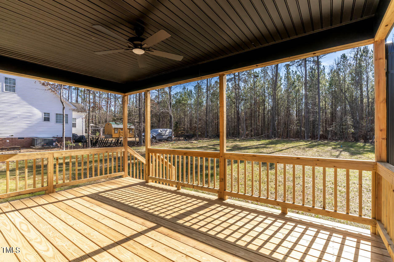 138 Rawhide Drive Spring Hope, NC 27882 - Photo 23 of 32 a view of a porch with wooden floor