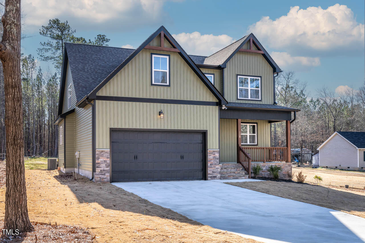 138 Rawhide Drive Spring Hope, NC 27882 - Photo 28 of 32 a front view of a house with a yard and garage
