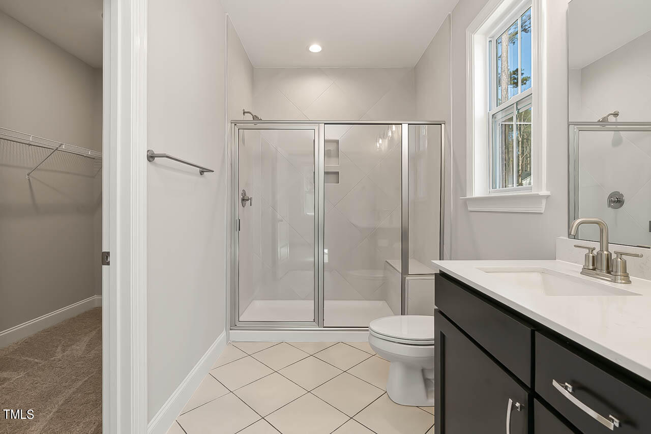 138 Rawhide Drive Spring Hope, NC 27882 - Photo 8 of 32 a bathroom with a sink a toilet and shower