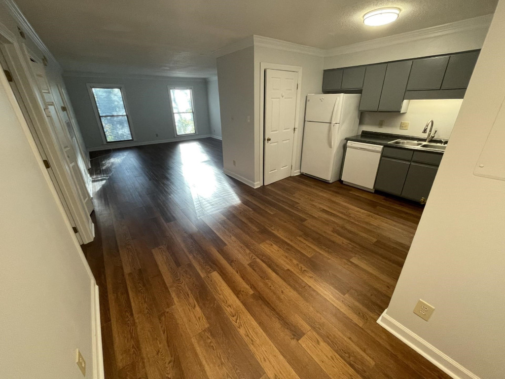 Undisclosed Address Raleigh, NC 27606 - Photo 5 of 14 a view of a kitchen from a hallway
