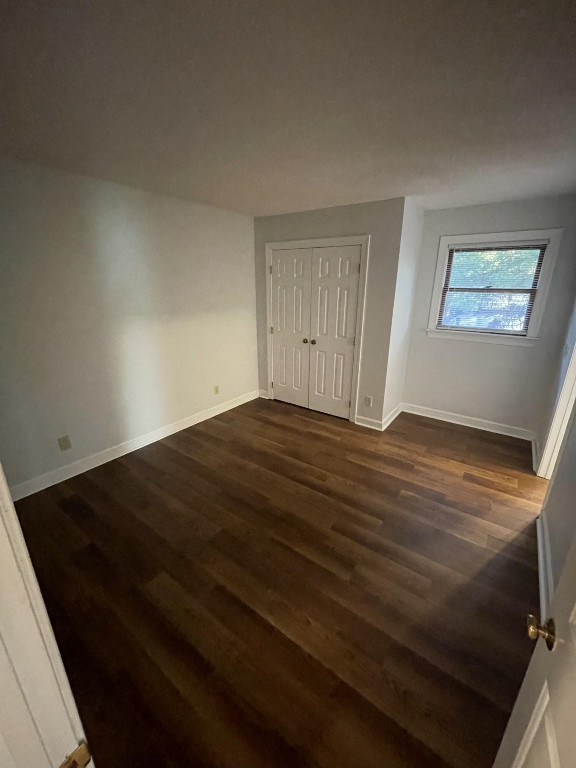 Undisclosed Address Raleigh, NC 27606 - Photo 7 of 14 a view of empty room with wooden floor