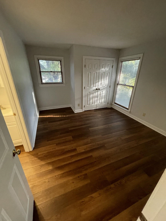 Undisclosed Address Raleigh, NC 27606 - Photo 10 of 14 a view of an empty room with wooden floor and a window