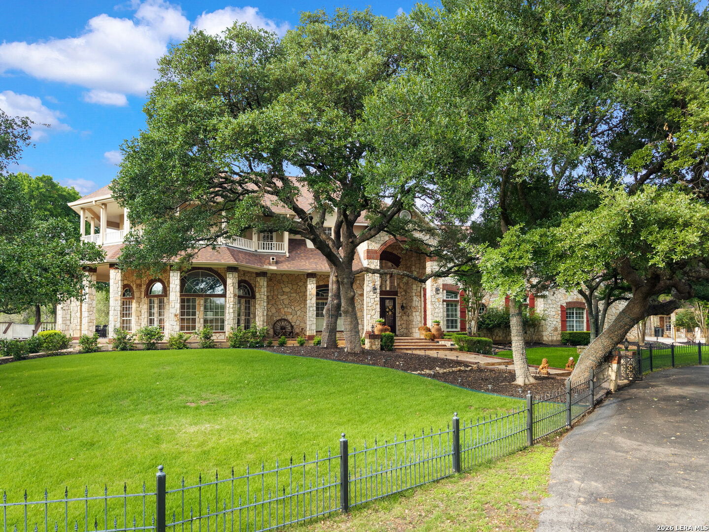 8040 Rolling Acres Trail Fair Oaks Ranch, TX 78015 - Photo 1 of 50 a front view of house with yard and green space