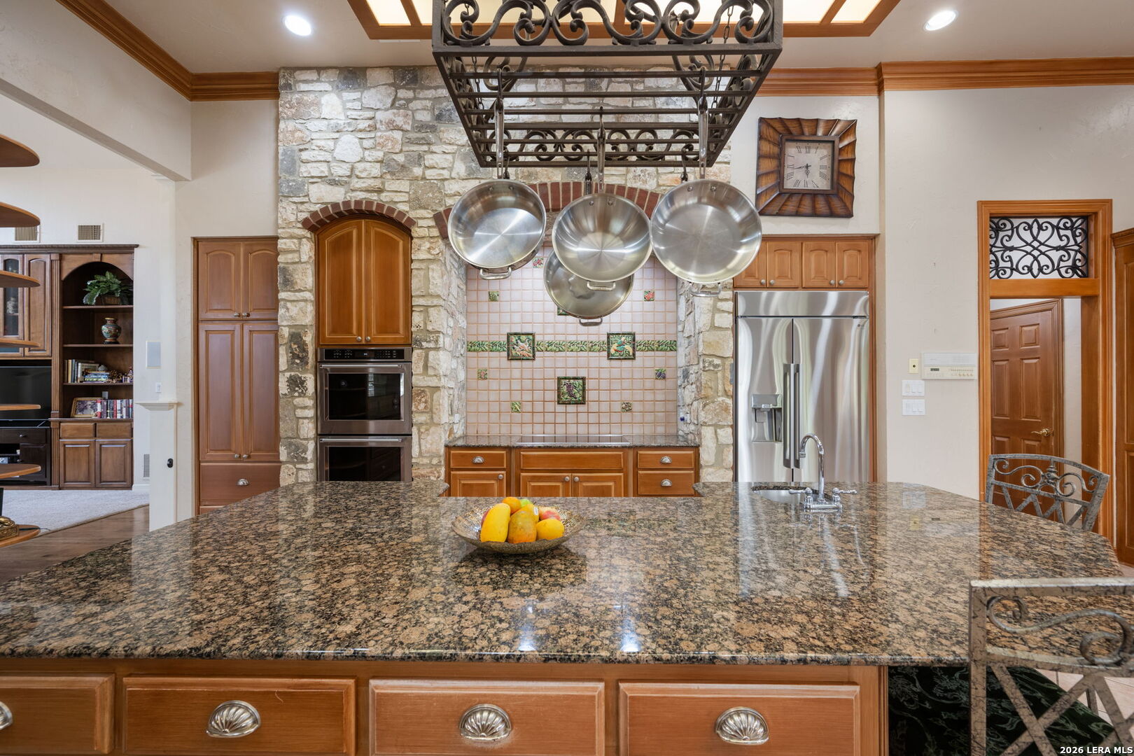 8040 Rolling Acres Trail Fair Oaks Ranch, TX 78015 - Photo 13 of 50 a kitchen with stainless steel appliances granite countertop a sink and cabinets