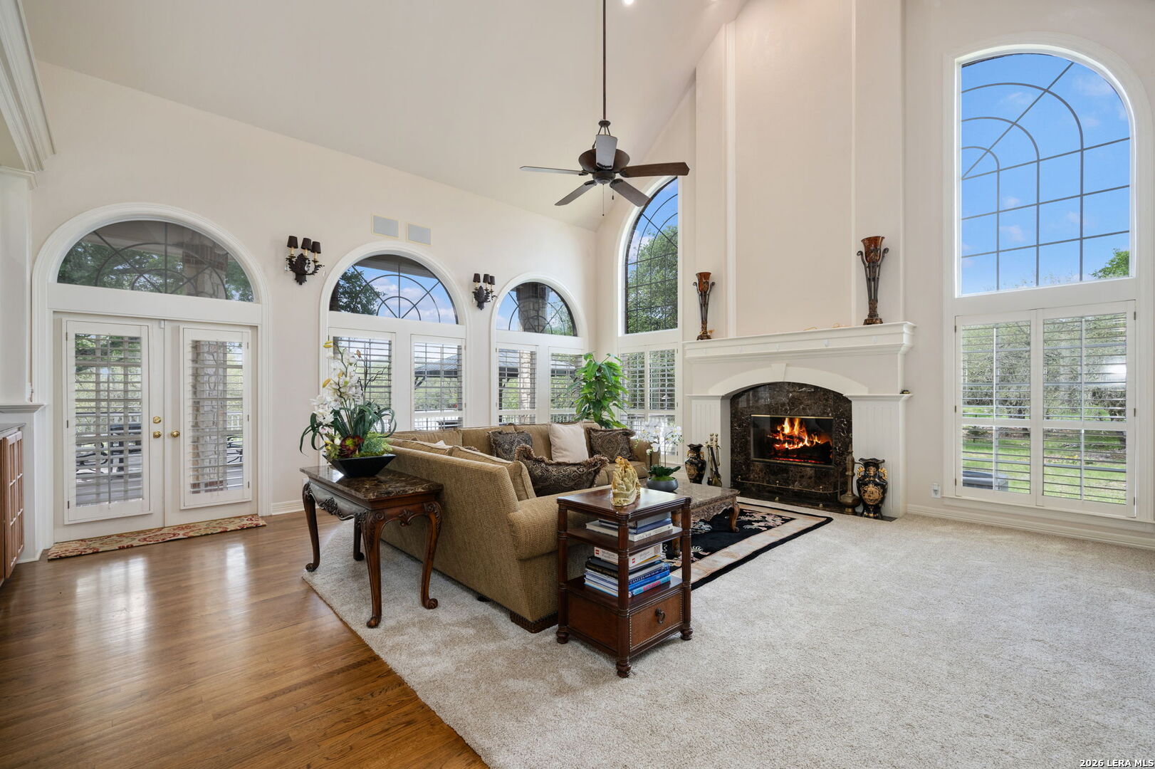 8040 Rolling Acres Trail Fair Oaks Ranch, TX 78015 - Photo 16 of 50 a living room with furniture and a fireplace