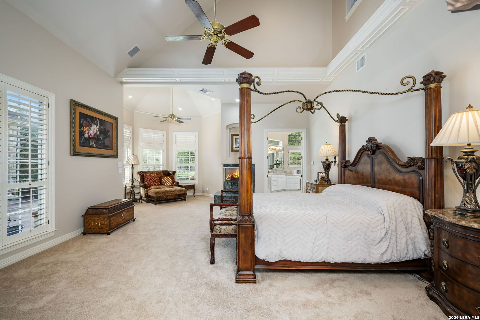 8040 Rolling Acres Trail Fair Oaks Ranch, TX 78015 - Photo 21 of 50 a bedroom with bed and a chandelier