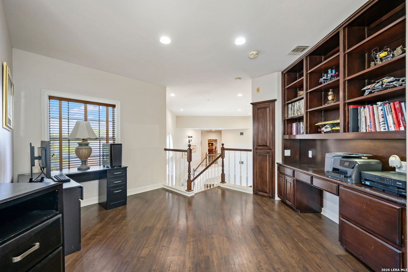 8040 Rolling Acres Trail Fair Oaks Ranch, TX 78015 - Photo 29 of 50 a living room with hard wood floors and a kitchen