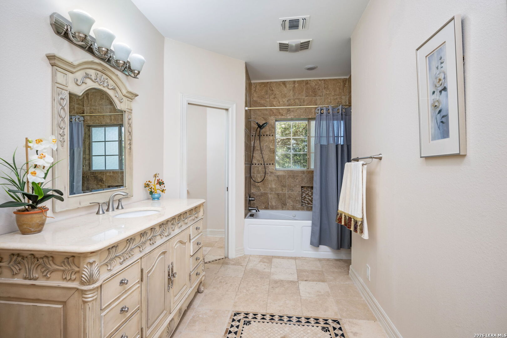 8040 Rolling Acres Trail Fair Oaks Ranch, TX 78015 - Photo 38 of 50 a spacious bathroom with a tub sink and mirror