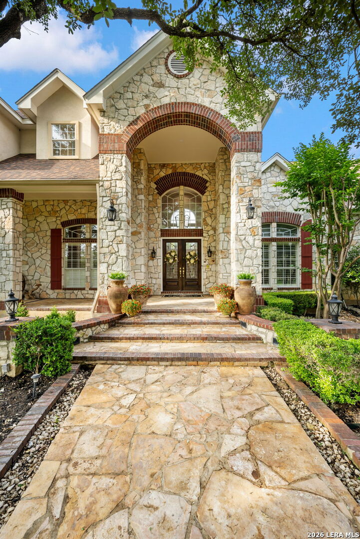 8040 Rolling Acres Trail Fair Oaks Ranch, TX 78015 - Photo 4 of 50 a view of a house with a swimming pool