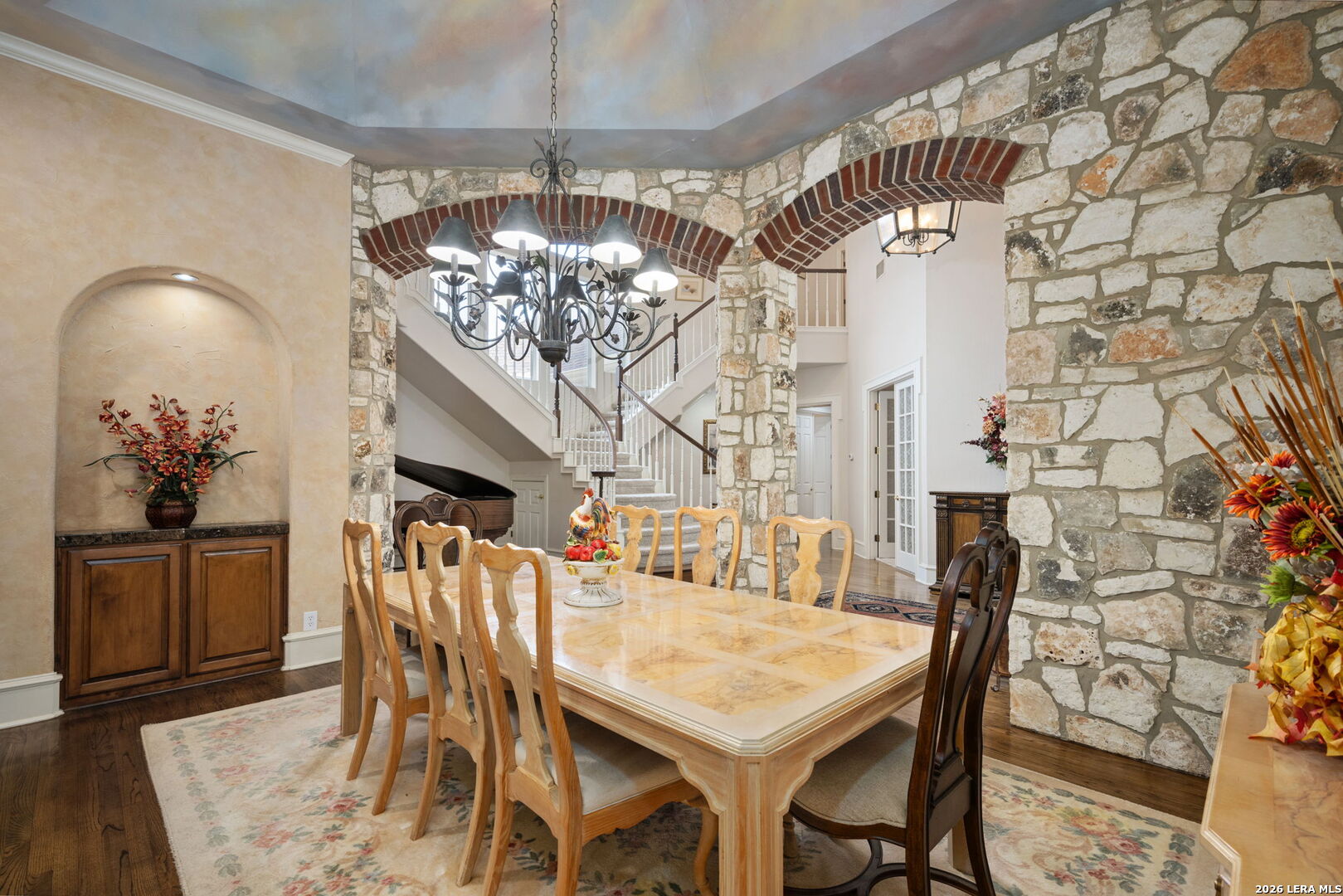 8040 Rolling Acres Trail Fair Oaks Ranch, TX 78015 - Photo 7 of 50 a view of a dining room with furniture and chandelier