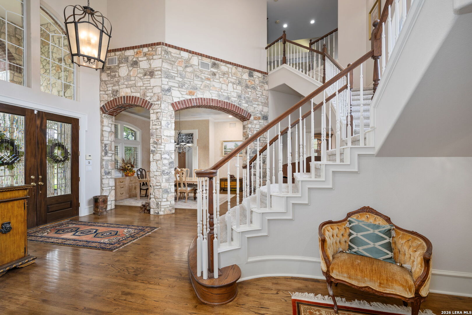 8040 Rolling Acres Trail Fair Oaks Ranch, TX 78015 - Photo 8 of 50 a view of entryway and hall with wooden floor
