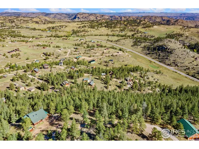 a view of a field with a mountain in the background