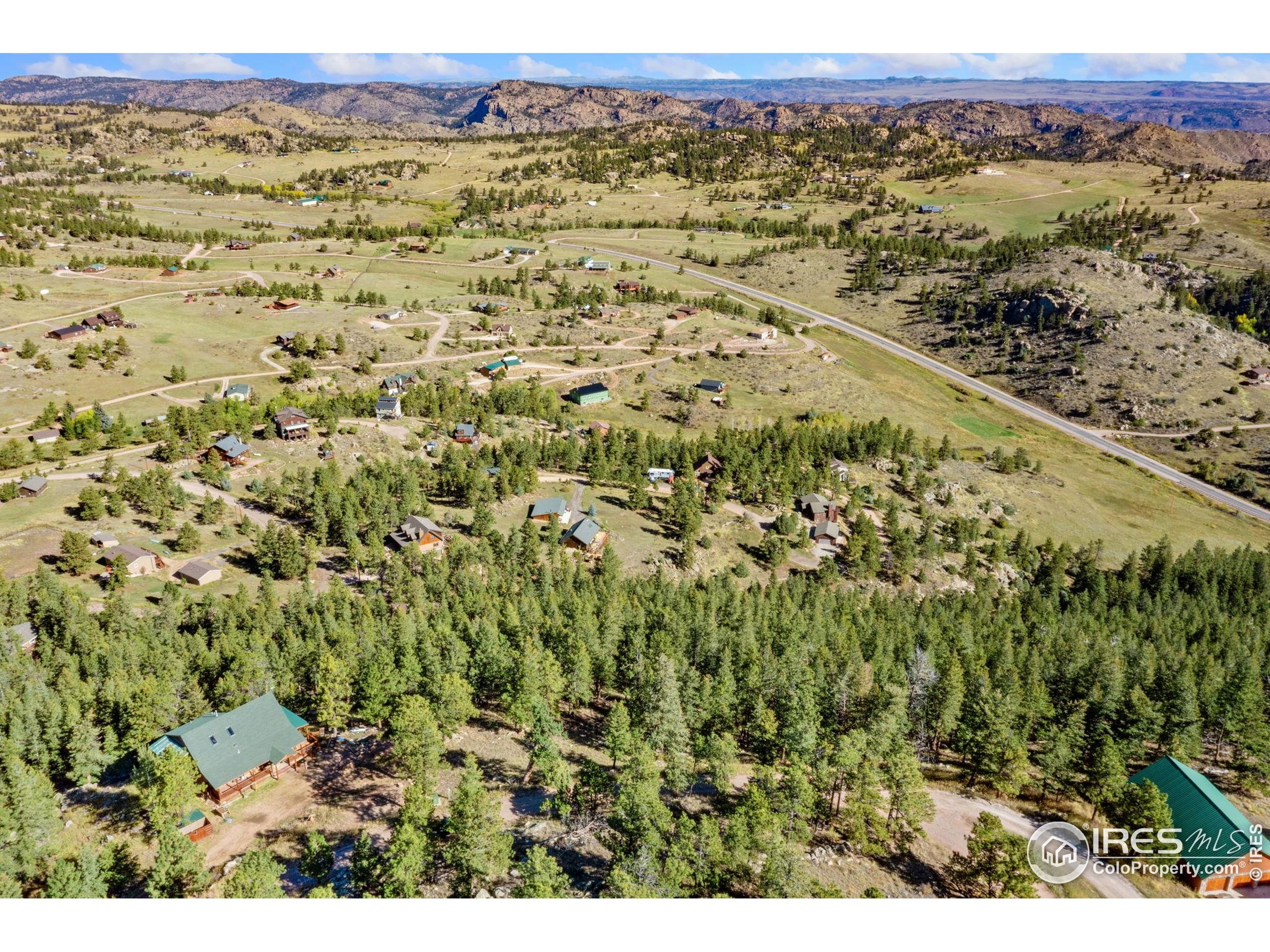 90 Sunlight Circle Livermore, CO 80536 - Photo 6 of 18 a view of a field with a mountain in the background