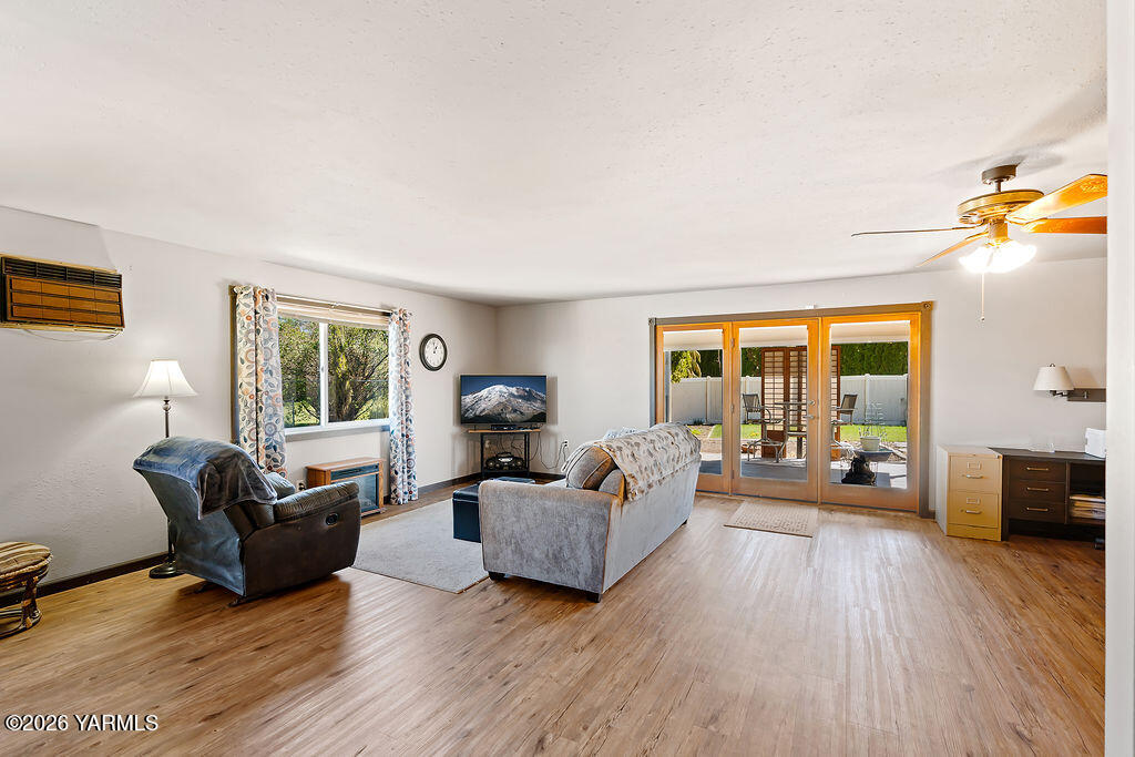3003 South 79th Avenue Yakima, WA 98903 - Photo 12 of 32 a living room with furniture and a wooden floor