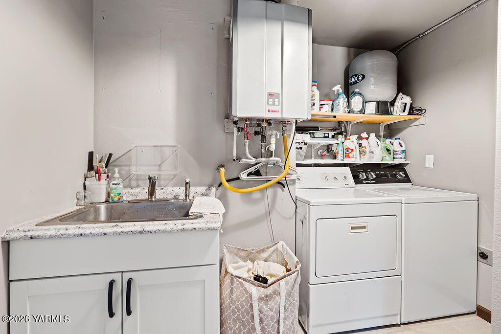 3003 South 79th Avenue Yakima, WA 98903 - Photo 16 of 32 a kitchen with a sink appliances and cabinets