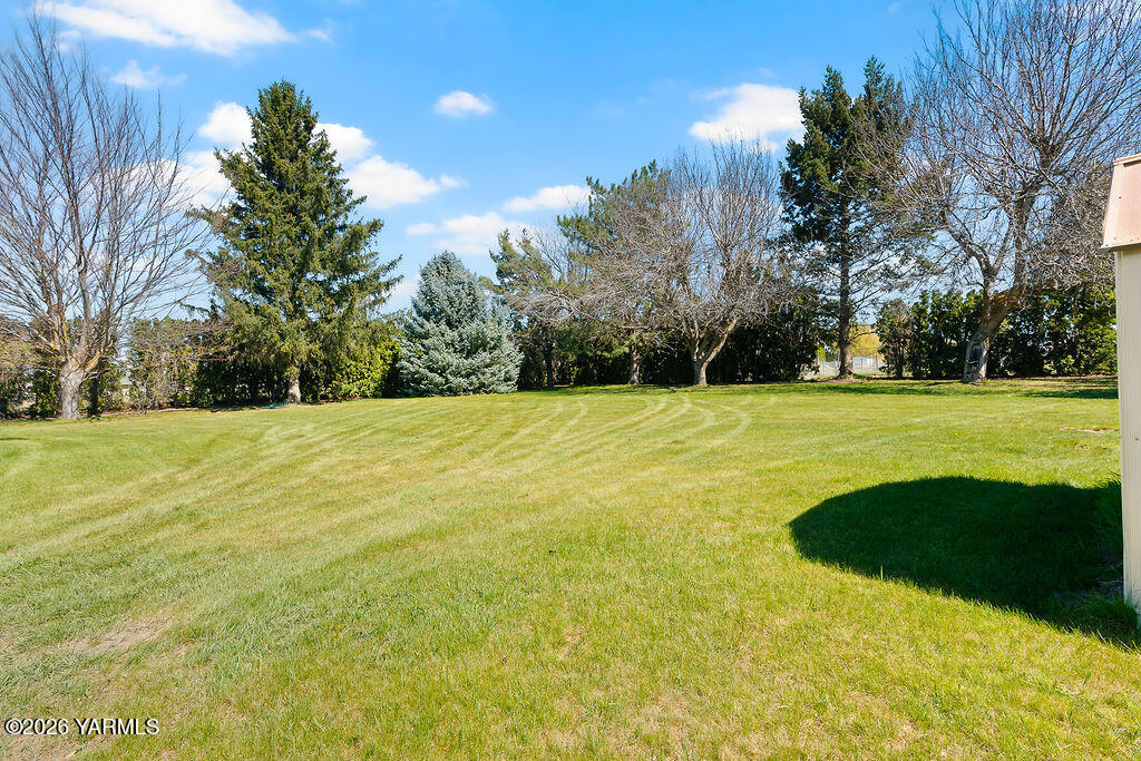 3003 South 79th Avenue Yakima, WA 98903 - Photo 31 of 32 a view of swimming pool with trees in the background
