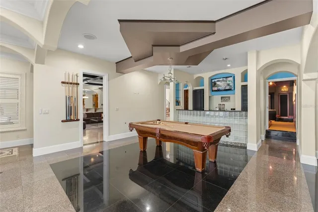 a kitchen with stainless steel appliances granite countertop a stove oven and sink