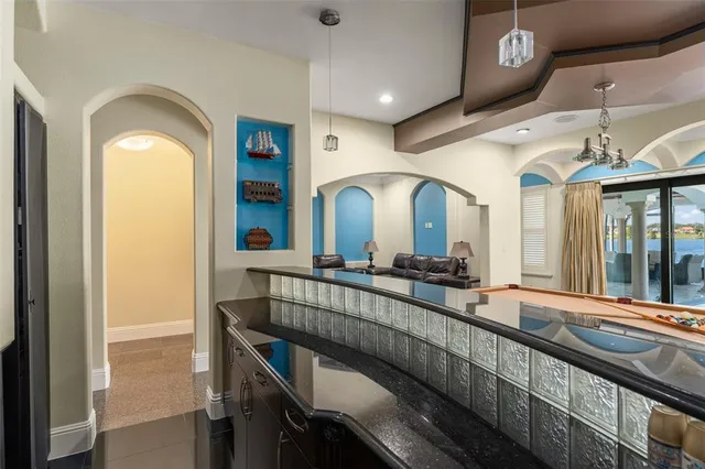 a stove top oven sitting inside of a kitchen