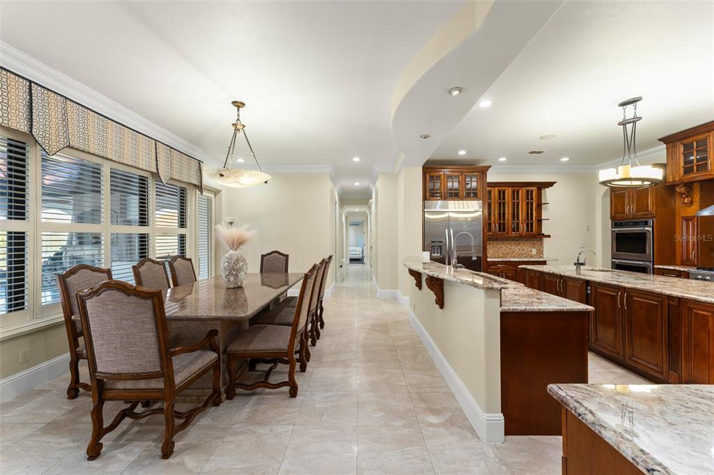 9575 Westover Roberts Road Windermere, FL 34786 - Photo 16 of 95 a large kitchen with a table and chairs