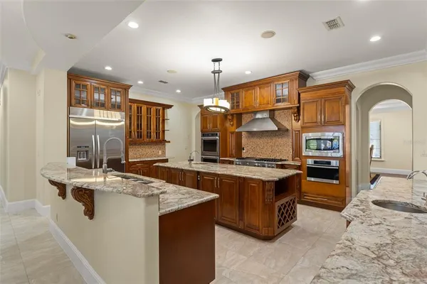 a dining room with furniture and chandelier