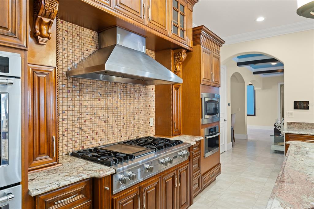 9575 Westover Roberts Road Windermere, FL 34786 - Photo 23 of 95 a stove top oven sitting inside of a kitchen